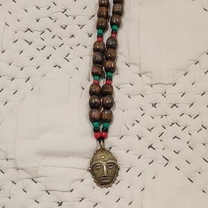 Handcrafted Beaded Necklace with Tribal Pendant